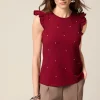 Top in jersey con castoni